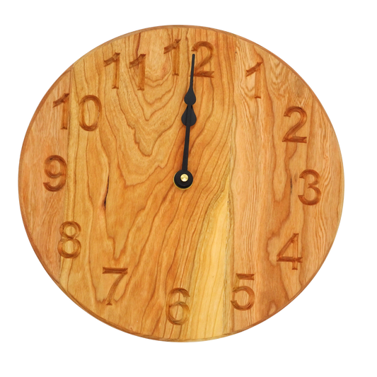 round cherry wooden wall clock with black spade hands and carved numbers
