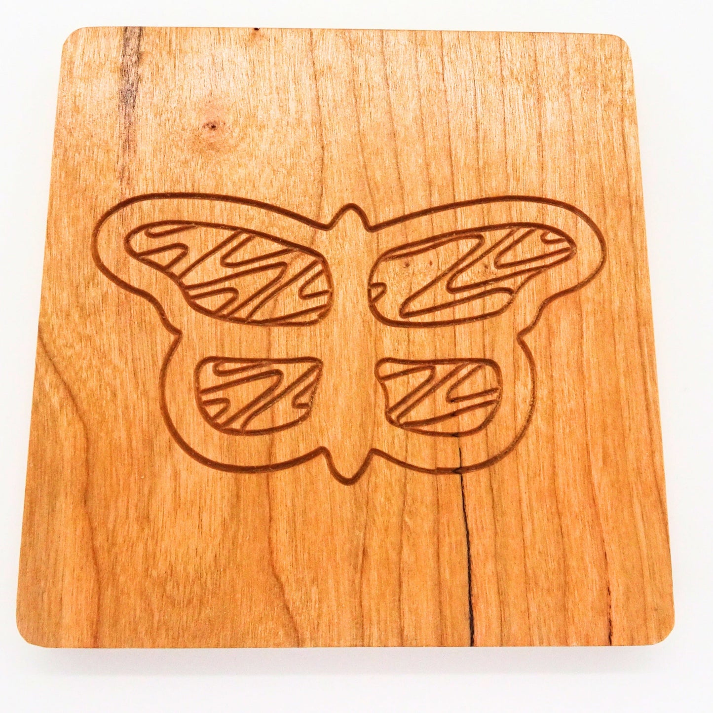 square wooden coaster with a butterfly design 