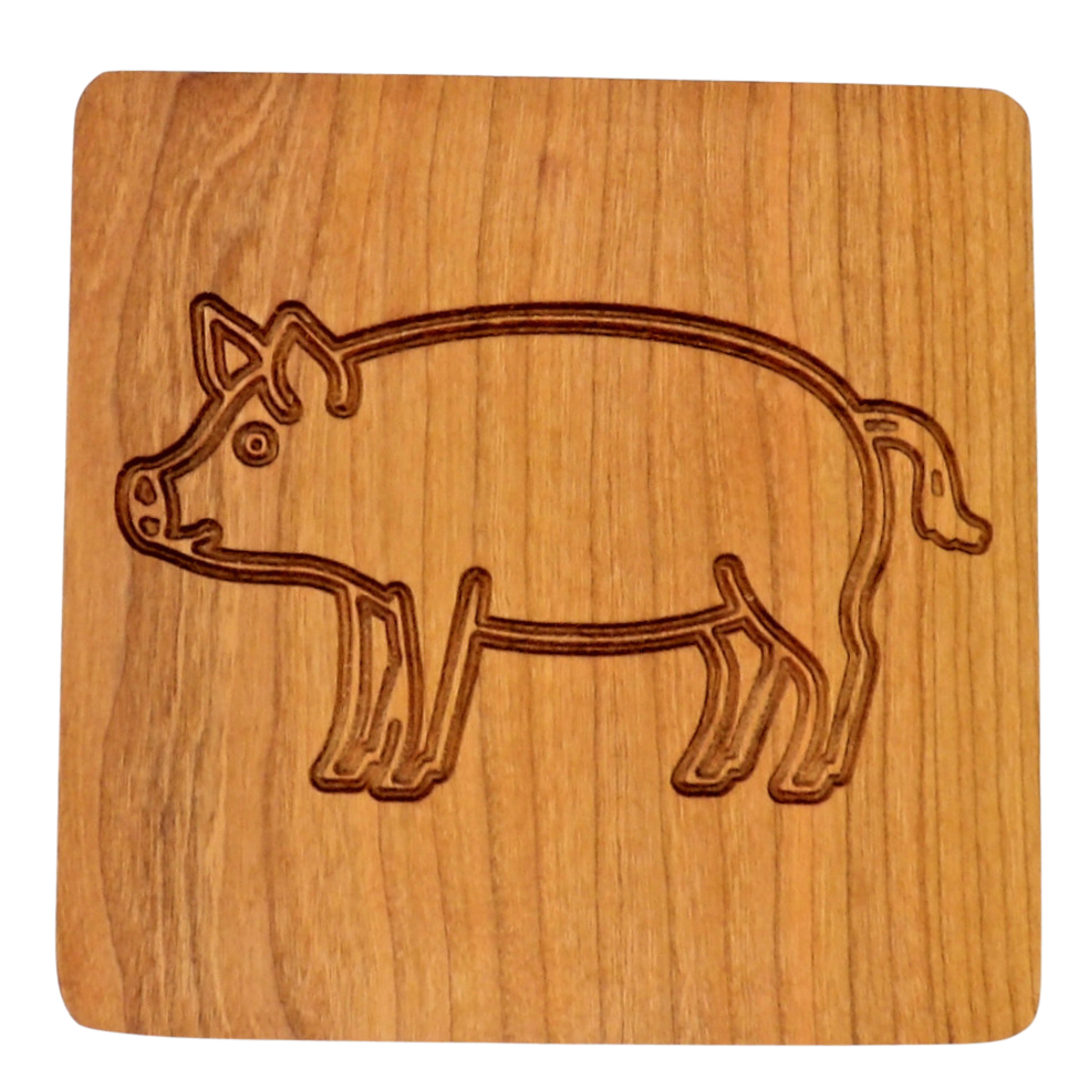 Wooden coaster with a pig design on a white background